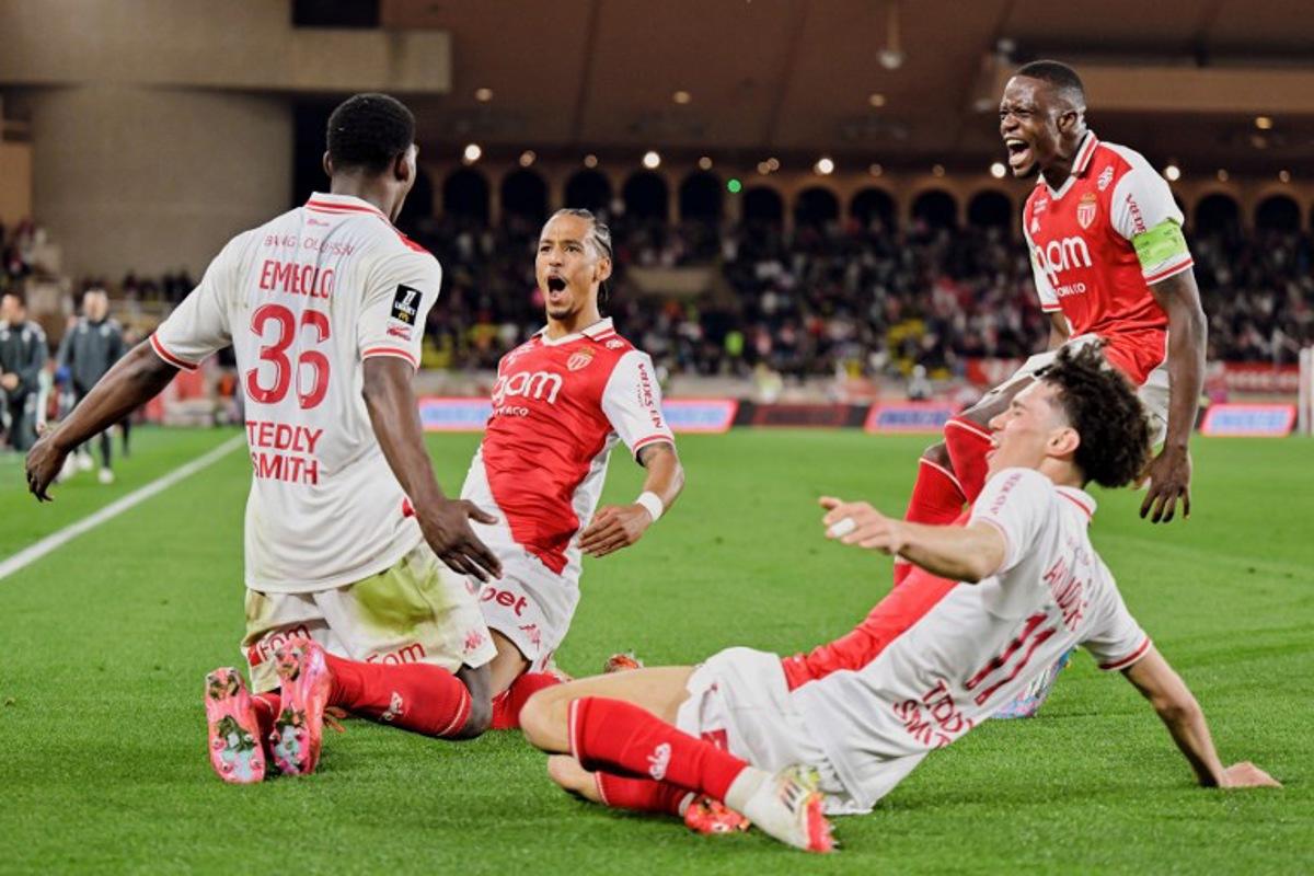 Monaco's Swiss forward #36 Breel Embolo (L), Monaco's German defender #05 Thilo Kehrer (2nd L) Monaco's Swiss midfielder #06 Denis Zakaria (R) and Monaco's French midfielder #11 Maghnes Akliouche (bottom R) celebrate the 2-1 goal during the French L1 football match between AS Monaco and Nice (OGCN) at the Louis II Stadium (Stade Louis II) in the Principality of Monaco on March 29, 2025. Frederic DIDES / AFP