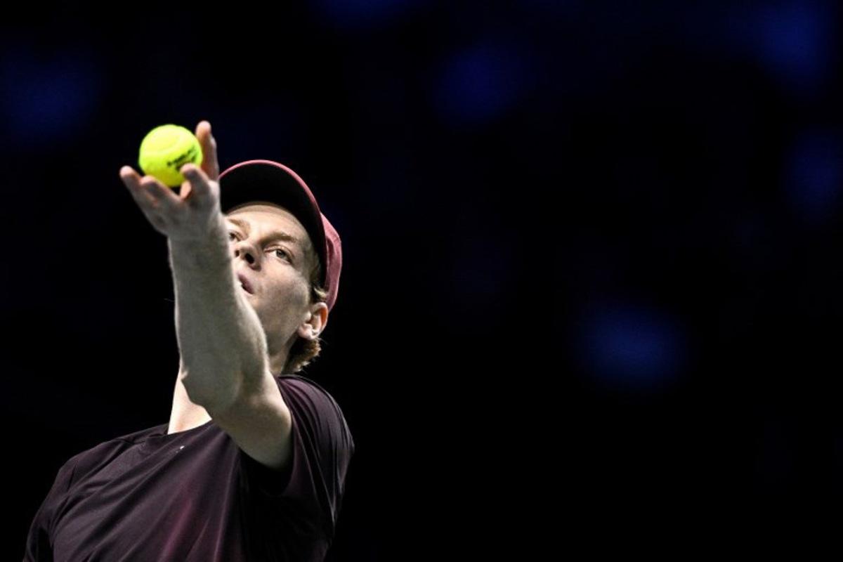 Italy's Jannik Sinner serves to US Ben Shelton during their men's singles quarter-final match on day five of the Paris ATP Masters 1000 tennis tournament at the Paris La Défense Arena in Nanterre, on the outskirts of Paris, on October 31, 2025. JULIEN DE ROSA / AFP
