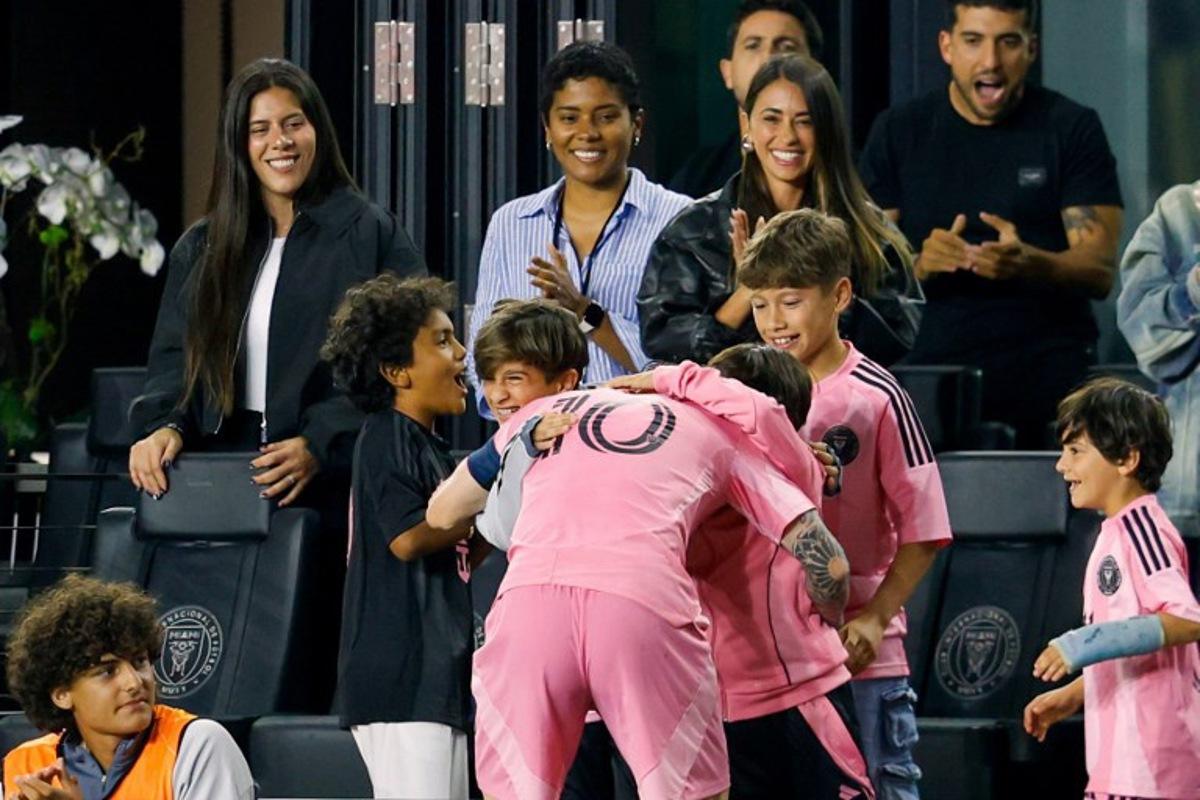 Inter Miami's Argentine forward #10 Lionel Messi hugs family as wife Antonela Roccuzzo looks on as he celebrates after scoring a goal in the second half of the CONCACAF Champions Cup Quartefinal football match between Inter Miami and LAFC at Chase Stadium in Fort Lauderdale, Florida on April 9, 2025. Chris Arjoon / AFP