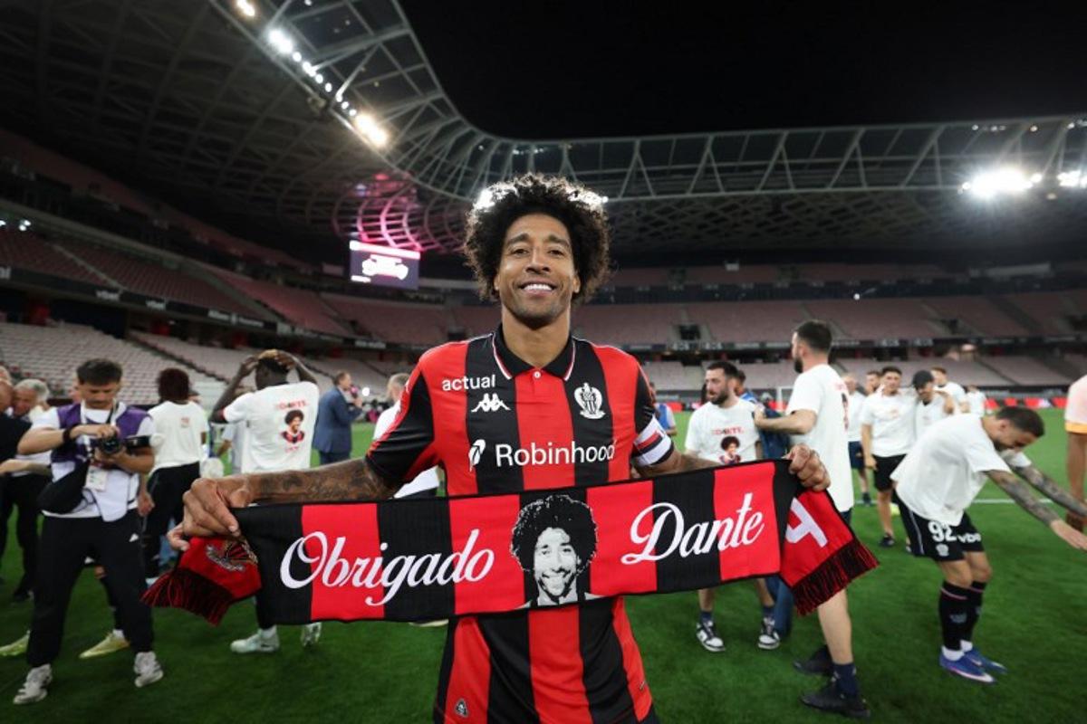 Nice's Brazilian defender #04 Dante celebrates after winning the L1-L2 playoff second-leg football match between first divison club OGC Nice and second division club AS Saint-Etienne at the Allianz Riviera Stadium in Nice, south-eastern France, on May 29, 2026. Valery HACHE / AFP