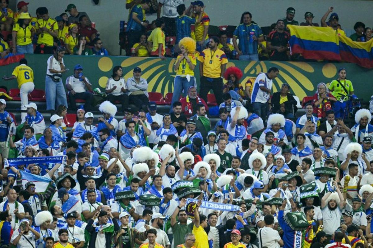 Uzbek fans cheer for their team during the 2026 World Cup Group K football match between Uzbekistan and Colombia at the Mexico City Stadium in Mexico City on June 17, 2026. Yuri CORTEZ / AFP