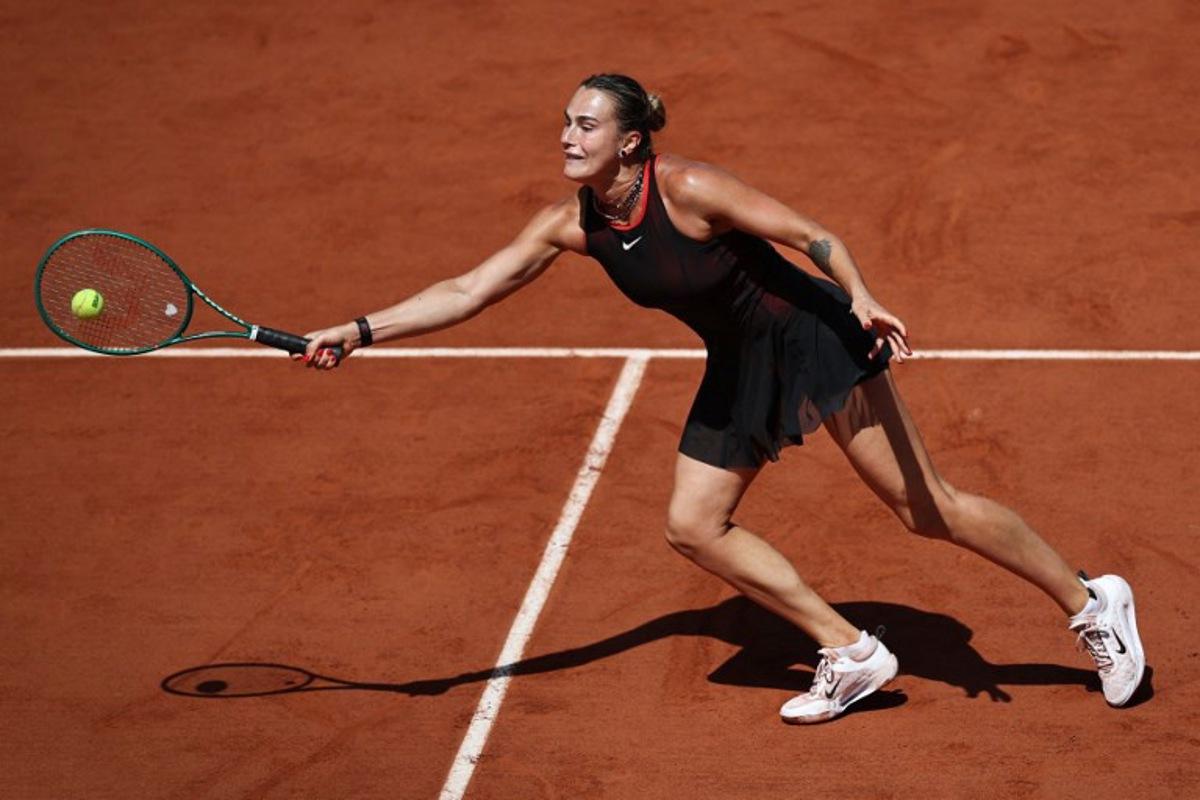 Aryna Sabalenka plays a forehand return to Australia's Daria Kasatkina during their women's singles match on day 7 of the French Open tennis tournament on Court Suzanne-Lenglen at the Roland-Garros Complex in Paris on May 30, 2026. Anne-Christine POUJOULAT / AFP