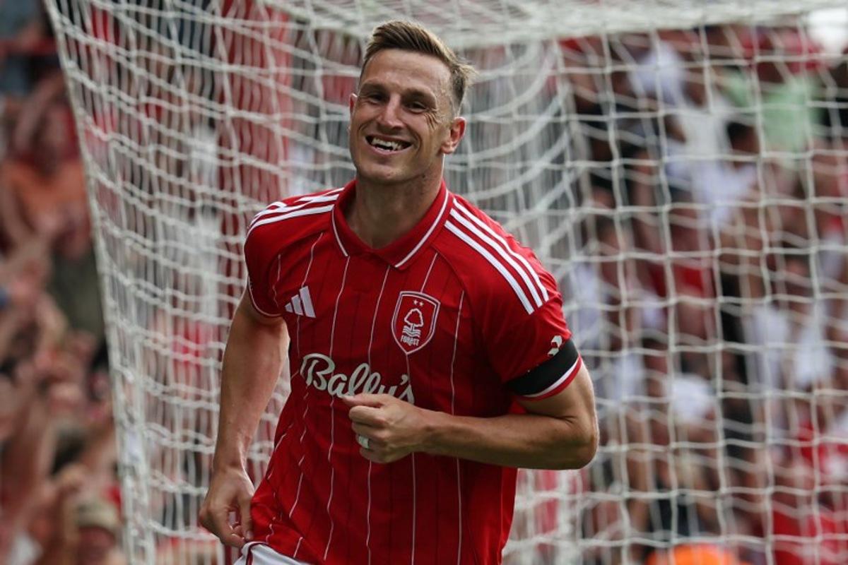 Nottingham Forest's New Zealand striker #11 Chris Wood celebrates after scoring their third goal during the English Premier League football match between Nottingham Forest and Brentford at The City Ground in Nottingham, central England, on August 17, 2025. Darren Staples / AFP