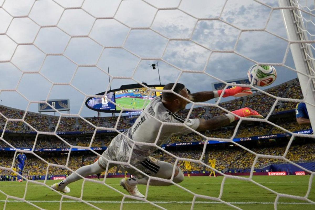 Curacao's goalkeeper #01 Eloy Room makes a save during the 2026 World Cup Group E football match between Ecuador and Curacao at the Kansas City Stadium in Kansas City on June 20, 2026. JUAN MABROMATA / AFP