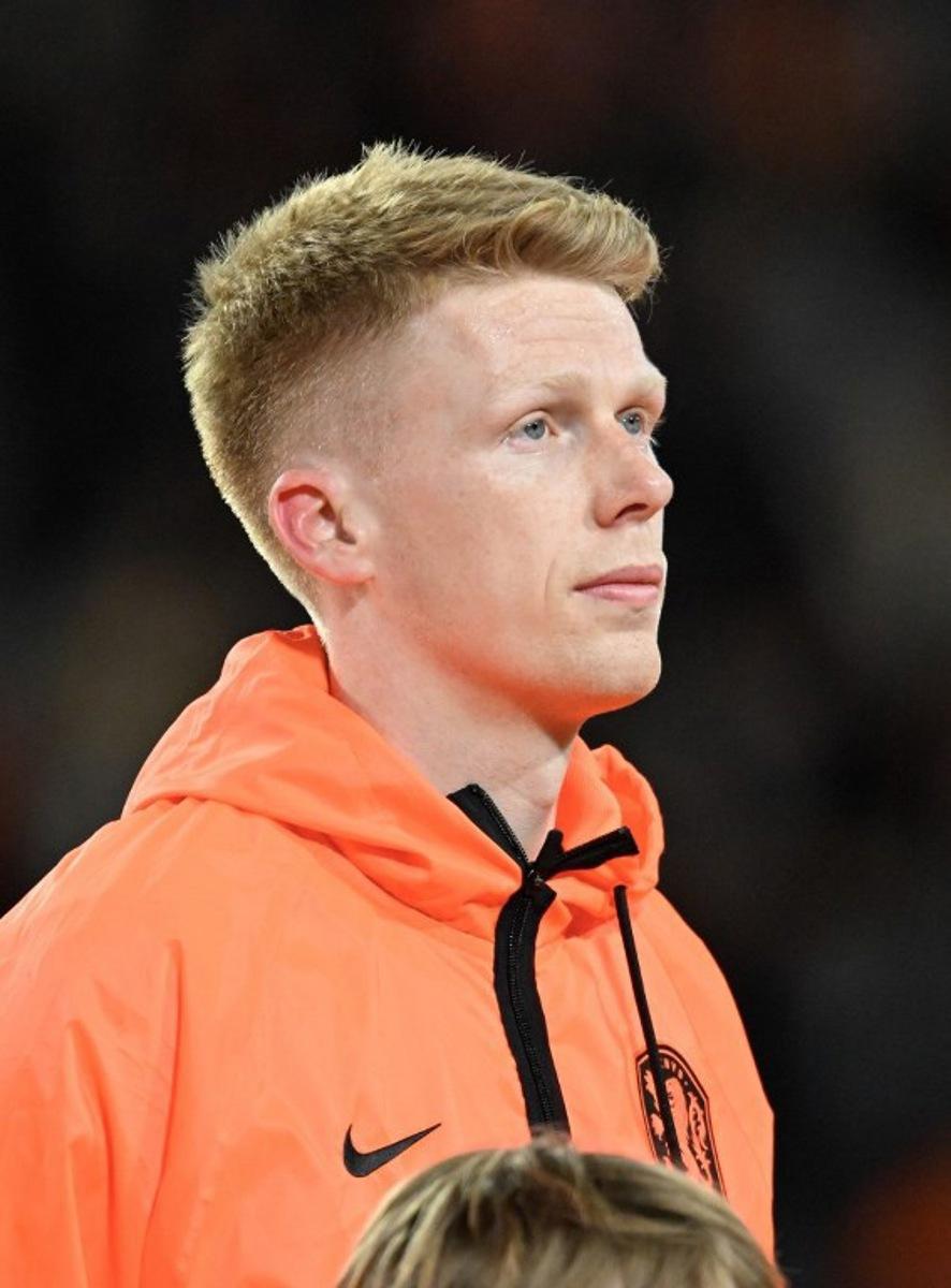 Netherlands' midfielder #16 Jerdy Schouten poses ahead of the friendly international football match between the Netherlands and Ecuador at the PSV Stadium in Eindhoven on March 31, 2026. JOHN THYS / AFP