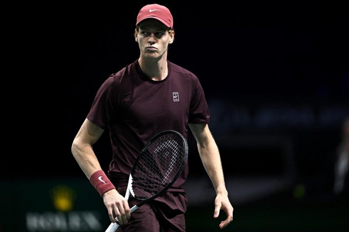Italy's Jannik Sinner reacts as he plays against US Ben Shelton during their men's singles quarter-final match on day five of the Paris ATP Masters 1000 tennis tournament at the Paris La Défense Arena in Nanterre, on the outskirts of Paris, on October 31, 2025. JULIEN DE ROSA / AFP