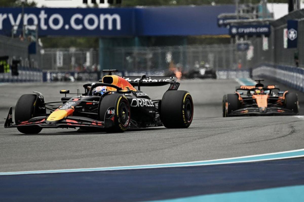 Red Bull Racing's Dutch driver Max Verstappen races ahead of McLaren's Australian driver Oscar Piastri during the 2025 Miami Formula One Grand Prix at Miami International Autodrome in Miami Gardens, Florida, on May 4, 2025. Chandan Khanna / AFP