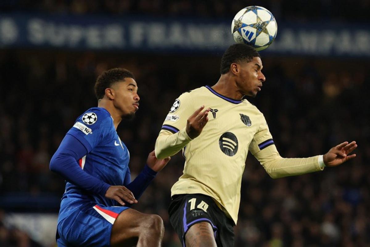 Barcelona's English forward #14 Marcus Rashford (R) wins a header during the UEFA Champions League league-phase football match between Chelsea and Barcelona at Stamford Bridge in London on November 25, 2025. Adrian Dennis / AFP