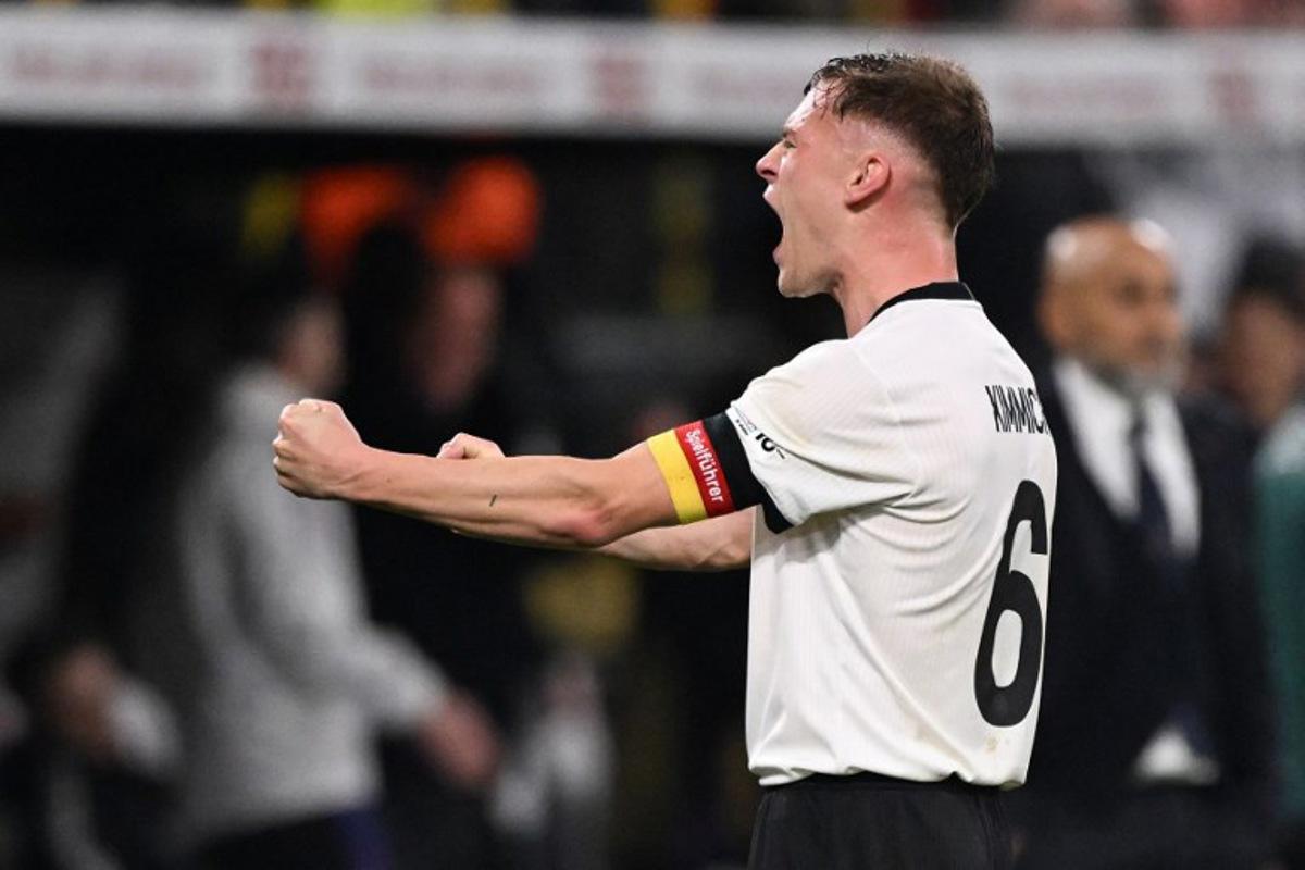 Germany's defender #06 Joshua Kimmich reacts after the final whistle of the UEFA Nations League quarter-final second leg football match Germany v Italy at the Signal Iduna Park stadium in Dortmund, western Germany on March 23, 2025. Kirill KUDRYAVTSEV / AFP