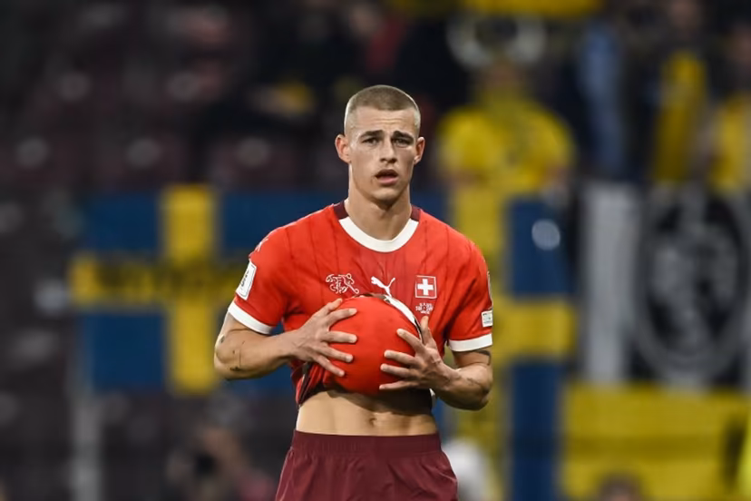 Switzerland's defender #2 Miro Muheim holds the ball during the FIFA World Cup 2026 Group B European qualification football match between Switzerland and Sweden at the Geneva stadium, in Geneva, on November 15, 2025. Fabrice COFFRINI / AFP
