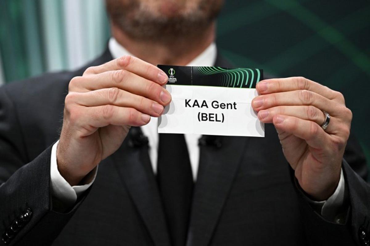 UEFA Europa Conference League final ambassador Czech former footballer Vladimir Smicer shows the paper slip of KAA Gent (BEL) during the draw for the quarter-final, semi-final and final of the 2022-2023 UEFA Europa Conference League football tournament, in Nyon, on March 17, 2023. Fabrice COFFRINI / AFP