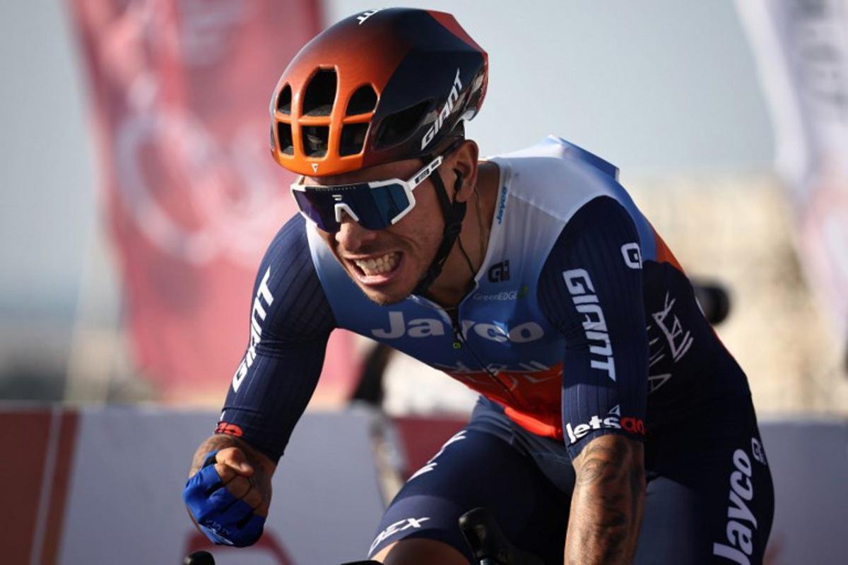 Australia's Caleb Ewan of Jayco Alula gestures as he crosses the finish line to win the first stage of the Tour of Oman between the Oman Across Ages Museum and the Oman Convention and Exhibition Centre in Muscat on February 10, 2024. Anne-Christine POUJOULAT / AFP