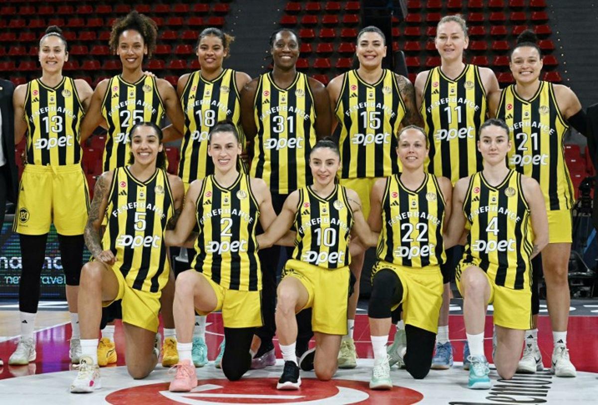 Fenerbahce players pose for a team photo before the Euroleague Women's semifinal basketball match between Fenerbahce and ZVVZ USK Prague at Pabellon Principe Felipe arena in Zaragoza on April 11, 2025. JAVIER SORIANO / AFP