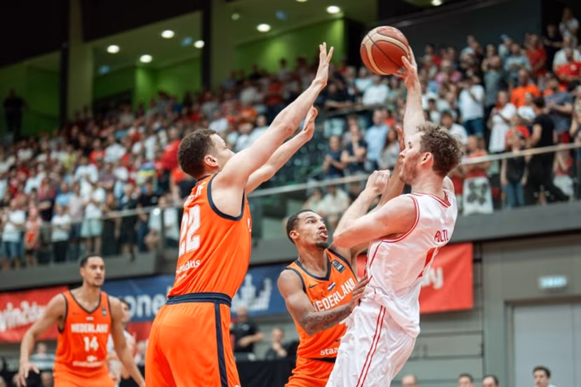 Netherlands' Jesse Edwards, Lucas Kruithof, Jamie Bergens and Austria's Jakob Poltl vie for the ball during pre-qualification match for the 2027 Men's Basketball World Cup between Austria and the Netherlands in Schwechat, Austria, on August 13, 2025. GEORG HOCHMUTH / APA / AFP