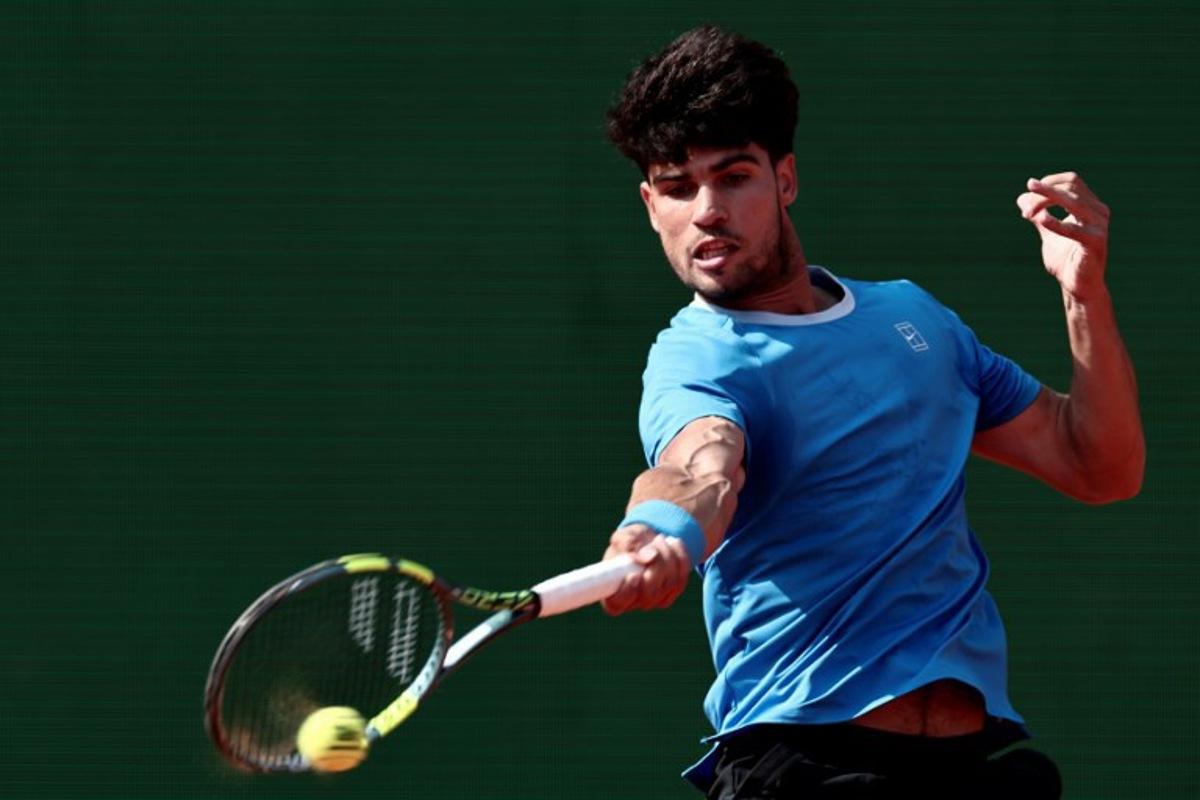 Spain's Carlos Alcaraz plays a forehand return to Monaco's Valentin Vacherot during the Monte Carlo ATP Masters Series Tournament semi-final tennis match on Court Rainier III at the Monte-Carlo Country Club in Roquebrune-Cap-Martin, south-eastern France on April 11, 2026. Thibaud MORITZ / AFP
