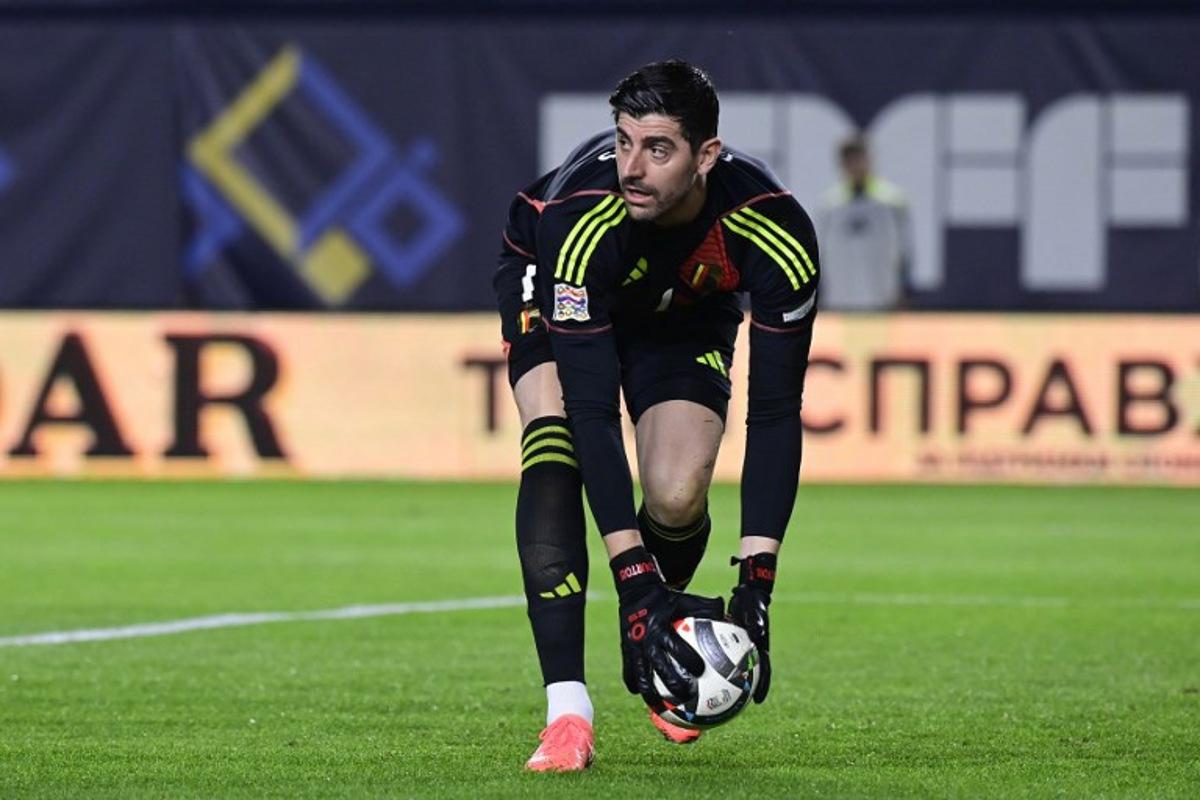 Belgium's goalkeeper #01 Thibaut Courtois takes the ball during the UEFA Nations League play-off first leg football match between Ukraine and Belgium at Enrique Roca stadium in Murcia, on March 20, 2025. JOSE JORDAN / AFP