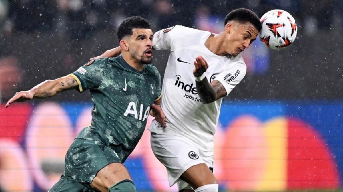 Tottenham Hotspur's English forward #19 Dominic Solanke (L) and Frankfurt's Brazilian defender #35 Tuta vie for the ball during the UEFA Europa League quarter-final second leg football match between Eintracht Frankfurt and Tottenham Hotspur in Frankfurt am Main, western Germany on April 17, 2025. Kirill KUDRYAVTSEV / AFP