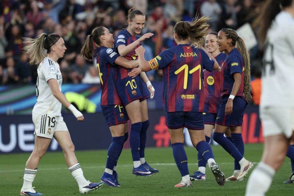 Barcelona's Norwegian forward #10 Caroline Graham Hansen (C) celebrates after scoring their fifth goal during the UEFA Women's Champions League quarter final second leg football match between FC Barcelona and Real Madrid CF at the Camp Nou stadium in Barcelona on April 2, 2026. Lluis GENE / AFP
