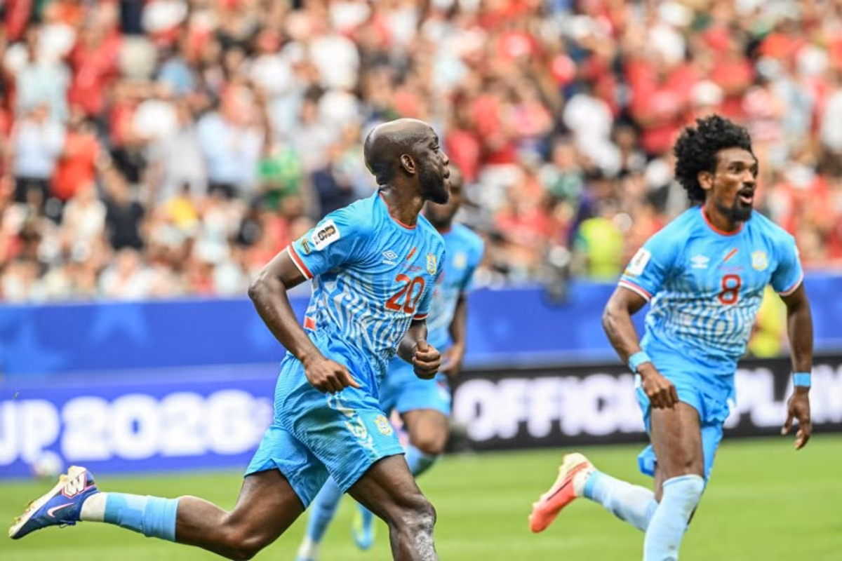 Congo DR's forward #20 Yoane Wissa (L) celebrates after scoring his team's first goal during the 2026 World Cup Group K football match between Portugal and the Democratic Republic of Congo at the Houston Stadium in Houston on June 17, 2026. RONALDO SCHEMIDT / AFP