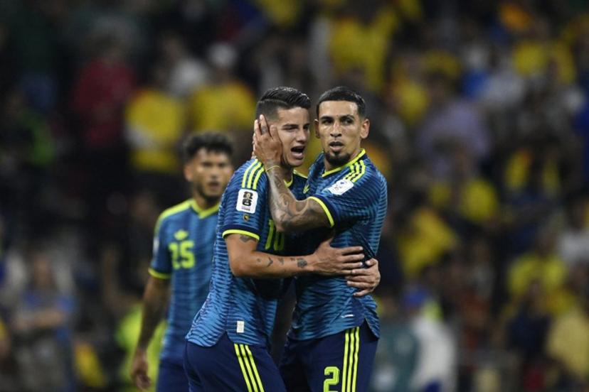 Colombia's defender #02 Daniel Munoz (R) celebrates after scoring his team's first goal with teammate midfielder #10 James Rodriguez during the 2026 World Cup Group K football match between Uzbekistan and Colombia at the Mexico City Stadium in Mexico City on June 17, 2026. Alfredo ESTRELLA / AFP