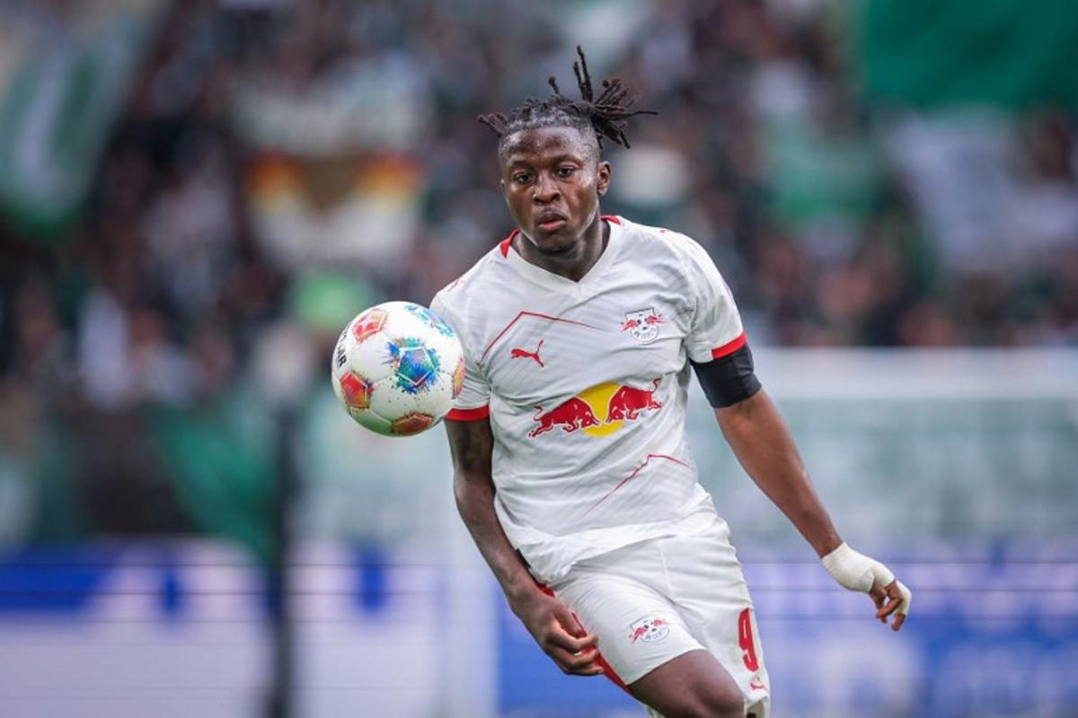 Leipzig's Belgian forward #09 Johan Bakayoko plays the ball during the German first division Bundesliga football match between VfL Wolfsburg and RB Leipzig in Wolfsburg, northern Germany on September 27, 2025. RONNY HARTMANN / AFP
