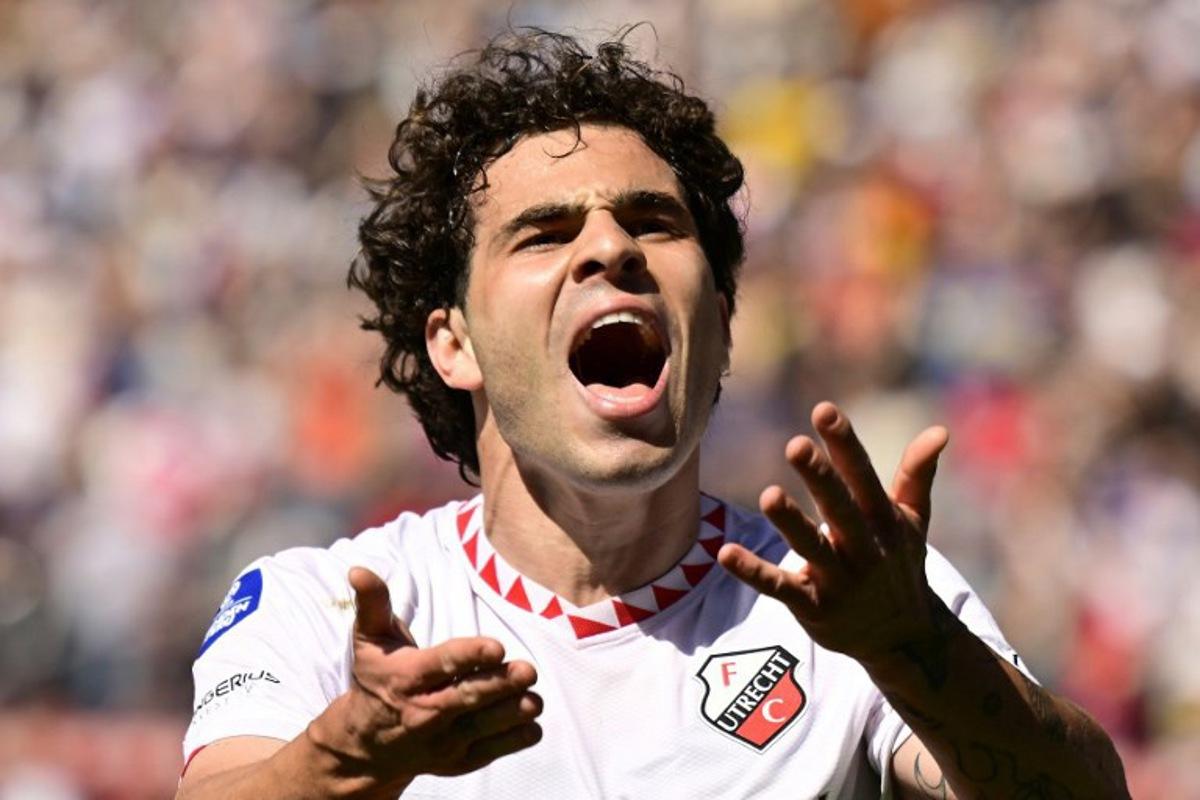 Utrecht's Spanish defender #22 Miguel Rodriguez celebrates after scoring his team's second goal during the Dutch Eredivisie football match between FC Utrecht and AFC Ajax at the Galgenwaard Stadium, in Utrecht on April 20, 2025. Olaf Kraak / ANP / AFP