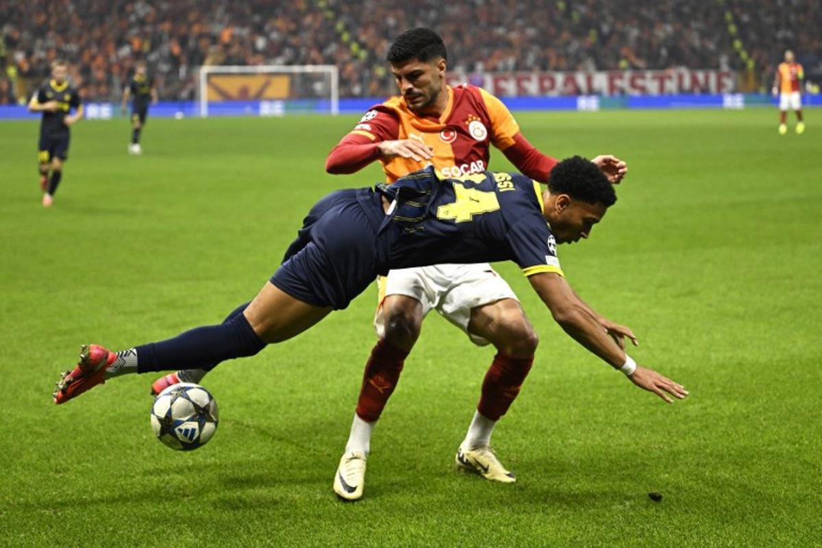 Galatasaray's Turkish defender #17 Evren Eren Elmali fouls Bodo/Glimt's Norwegian forward #24 Daniel Bassi during the UEFA Champions League, league phase - day 3, football match between Galatasaray SK and Bodo/Glimt at the Rams Park in Istanbul on October 22, 2025. YASIN AKGUL / AFP