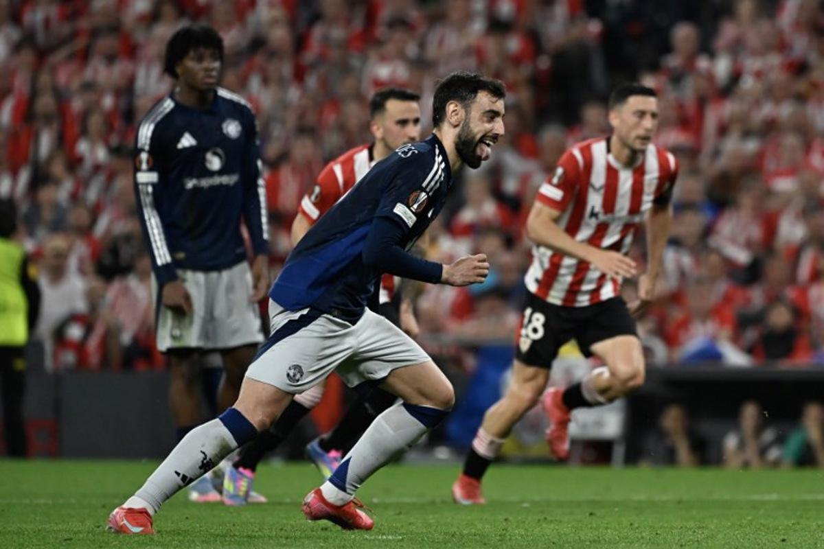 Manchester United's Portuguese midfielder #08 Bruno Fernandes celebrates scoring their second goal during the UEFA Europa League semi final first leg football match between Athletic Club Bilbao and Manchester United at the San Mames stadium in Bilbao, on May 1, 2025. ANDER GILLENEA / AFP