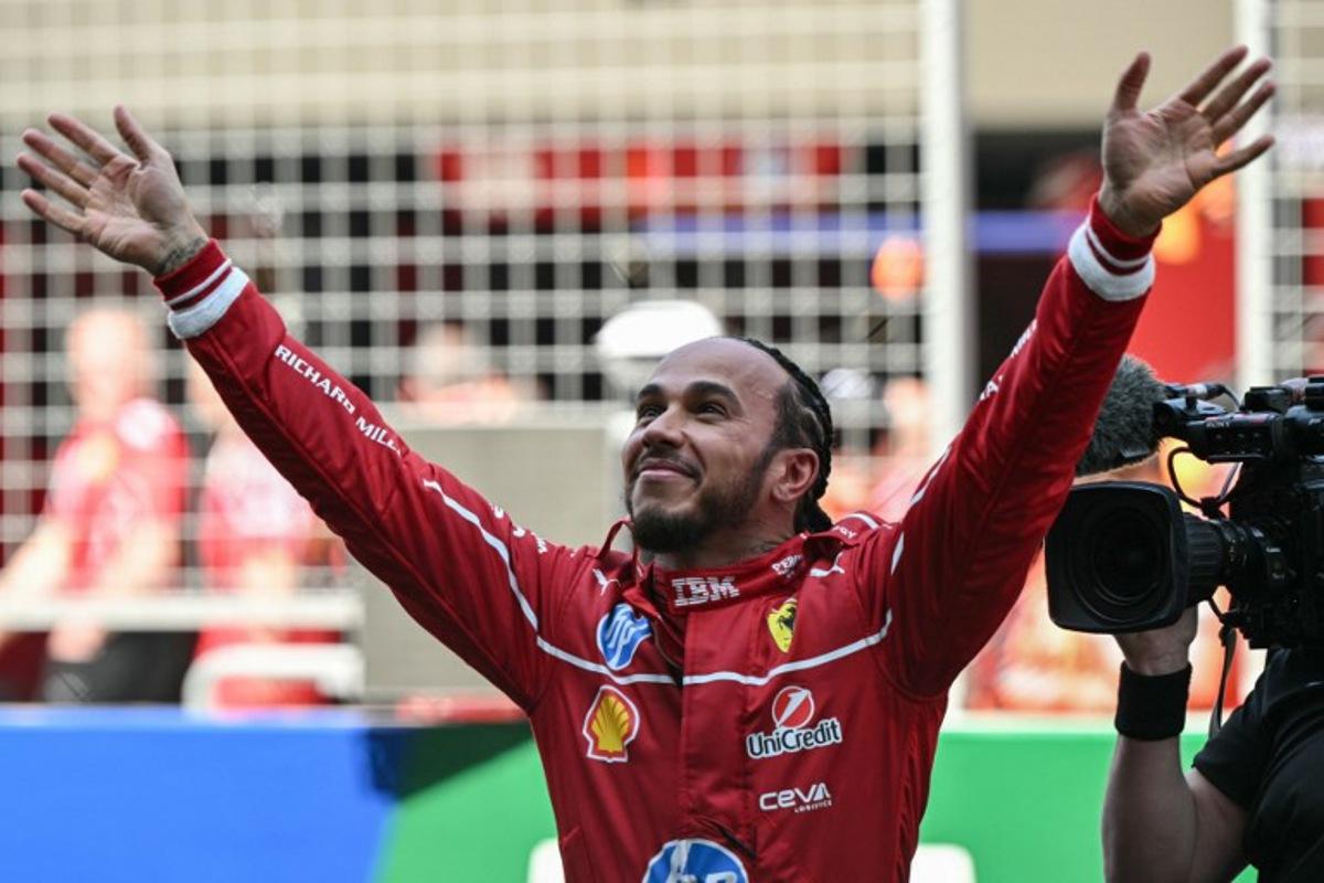 Ferrari's British driver Lewis Hamilton celebrates winning the sprint race of the Formula One Chinese Grand Prix at the Shanghai International Circuit in Shanghai on March 22, 2025. Greg Baker / AFP