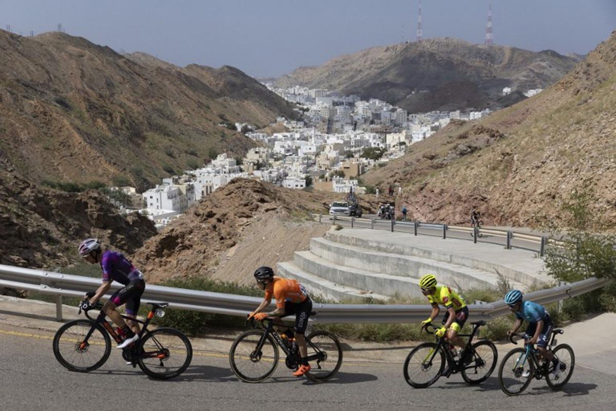 (L to R) Burgos BH's rider Victor Langellotti, Euskatel-Euskadi's Antonio Angulo Sampedro, Bingoal Pauwels Sauces WB's Johan Meens, and Astana Qazaqstan Team's Harold Martin Lopez Granizo ride during the sixth stage of the Oman Tour, between al-Mouj Muscat and Matrah Corniche, in Muscat on February 15, 2022. Thomas SAMSON / AFP