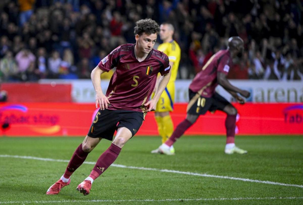 Belgium's midfielder #05 Maxim De Cuyper celebrates after scoring his team's first goal during the UEFA Nations League Play-offs Group A - second leg football match between Belgium and Ukraine at the Arena Genk - Cegeka Arena stadium in Genk, northeastern Belgium, on March 23, 2025. JOHN THYS / AFP