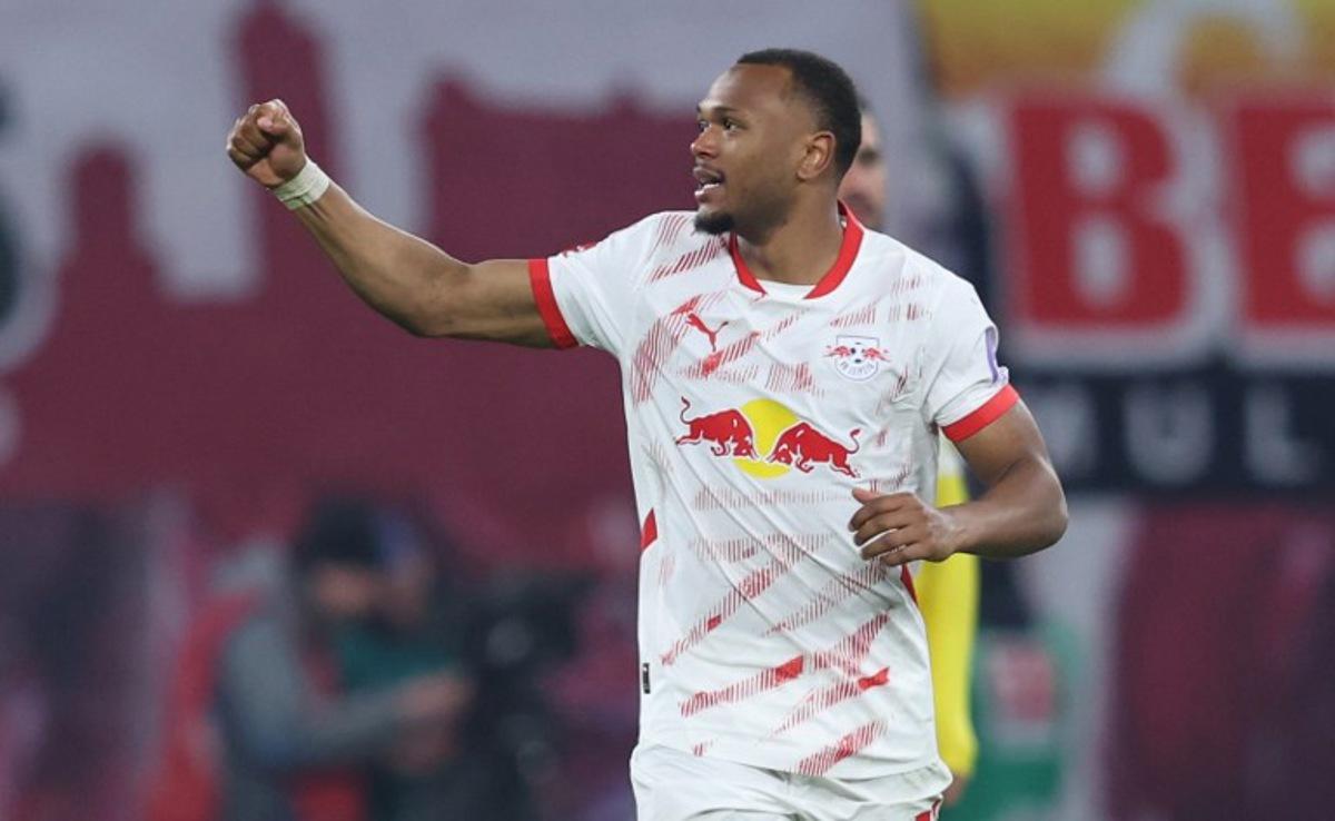 Leipzig's Belgian forward #11 Lois Openda celebrates scoring during the German first division Bundesliga football match between RB Leipzig and Borussia Dortmund in Leipzig, eastern Germany on March 15, 2025. RONNY HARTMANN / AFP