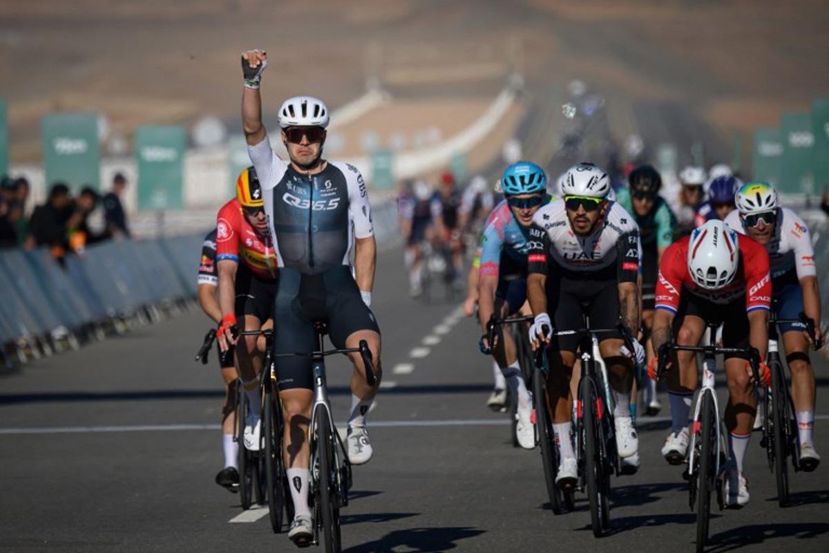 Q36.5 Pro Cycling Team's Italian rider Matteo Moschetti (L) celebrates his victory as he crosses the finish line of the fifth stage of the the Alula Tour cycling race in Alula on February 1, 2025. Loic VENANCE / AFP
