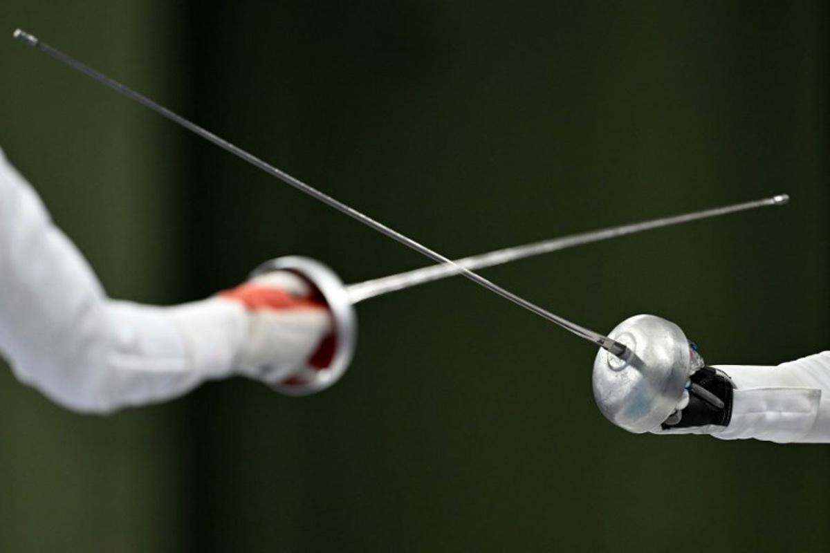China's Tang Junyao and Italy's Alberta Santuccio compete in the women's epee team semi-final bout during the Paris 2024 Olympic Games at the Grand Palais in Paris, on July 30, 2024. Fabrice COFFRINI / AFP