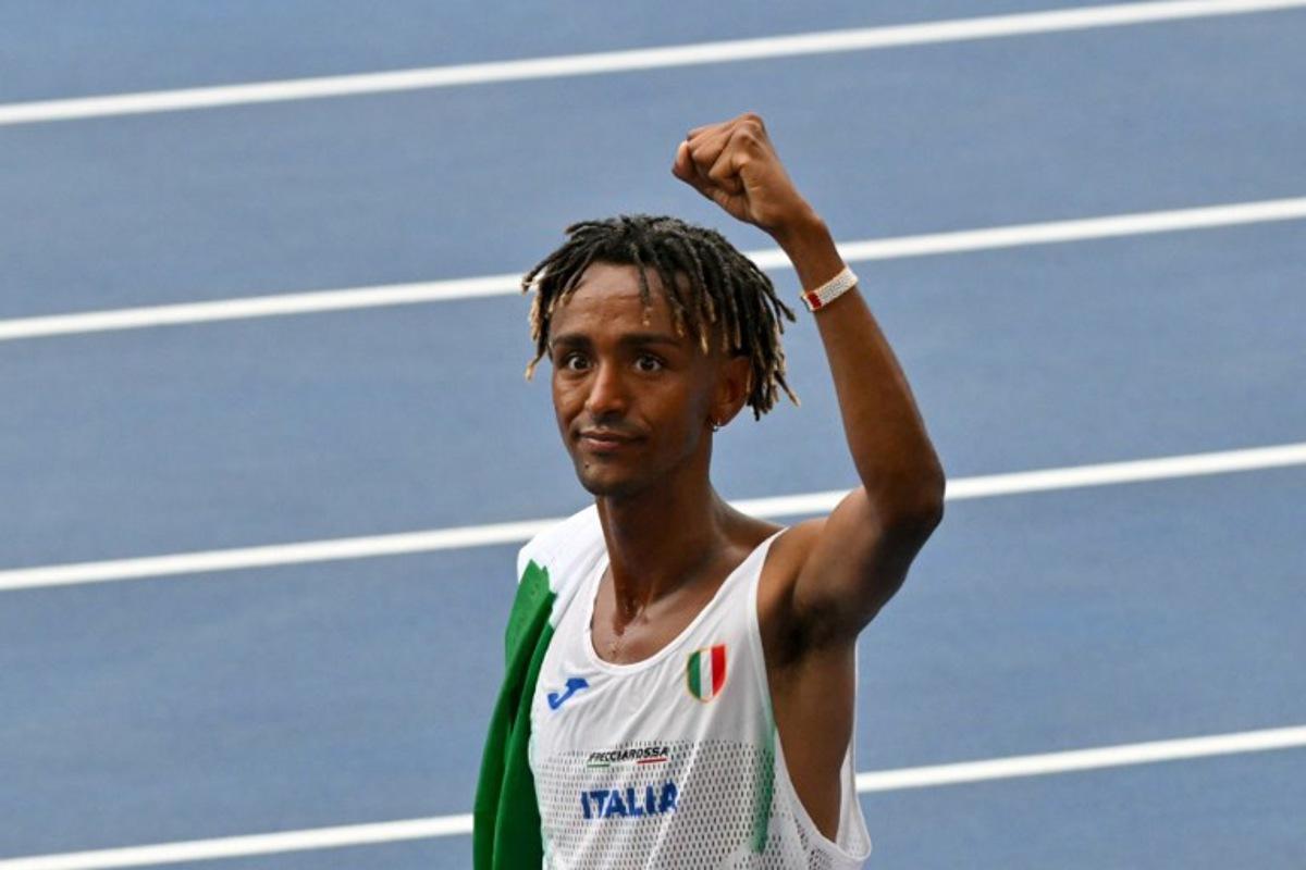 Italy's Yemaneberhan Crippa celebrates after winning the men's half marathon final during the European Athletics Championships at the Olympic stadium in Rome on June 9, 2024. Andreas SOLARO / AFP