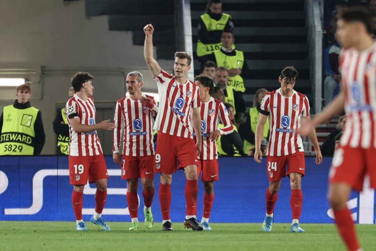 Atletico Madrid's Norwegian forward #09 Alexander Sorloth (C) celebrates scoring his team's second goal during the UEFA Champions League quarter final first leg football match between FC Barcelona and Club Atletico de Madrid at Camp Nou Stadium in Barcelona on April 8, 2026. Lluis GENE / AFP