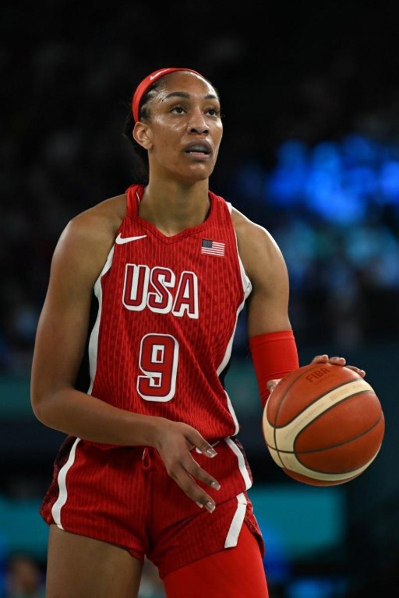 USA's #09 A'ja Wilson prepares to take a free throw in the women's Gold Medal basketball match between France and the USA during the Paris 2024 Olympic Games at the Bercy Arena in Paris on August 11, 2024. Paul ELLIS / AFP