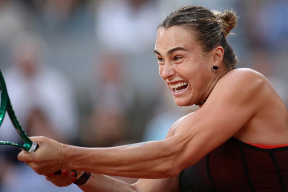 Aryna Sabalenka plays a backhand return to Japan's Naomi Osaka during their women's singles match on day 9 of the French Open tennis tournament on Court Philippe-Chatrier at the Roland-Garros Complex in Paris on June 1, 2026. ALAIN JOCARD / AFP