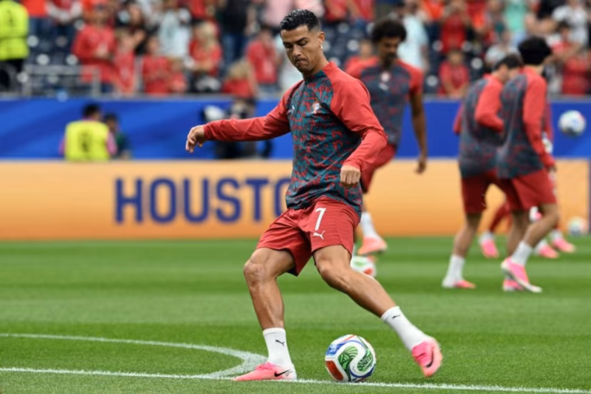Portugal's forward #07 Cristiano Ronaldo warms up ahead of the 2026 World Cup Group K football match between Portugal and the Democratic Republic of Congo at the Houston Stadium in Houston on June 17, 2026. RONALDO SCHEMIDT / AFP