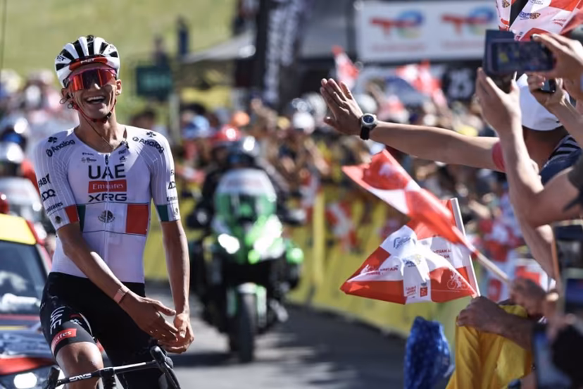 UAE Team Emirates XRG's Mexican rider Isaac Del Toro Romero celebrates as he cycles to the finish line to win the 8th and final stage of the Tour Auvergne-Rhone-Alpes cycling race (formerly known as the Criterium du Dauphine), 120,1km between Beaufort and Plateau de Solaison, in the French Alps on June 14, 2026. Anne-Christine POUJOULAT / AFP