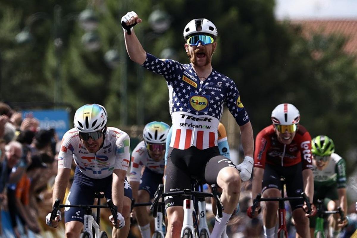 Lidl-Trek's US rider Quinn Simmons celebrates as he crosses the finish line to win the 4th stage of the Tour Auvergne-Rhone-Alpes cycling race (formerly known as the Criterium du Dauphine), 167,4km between Le Puy-en-Velay and Montrond-les-Bains, central France, on June 10, 2026. Anne-Christine POUJOULAT / AFP