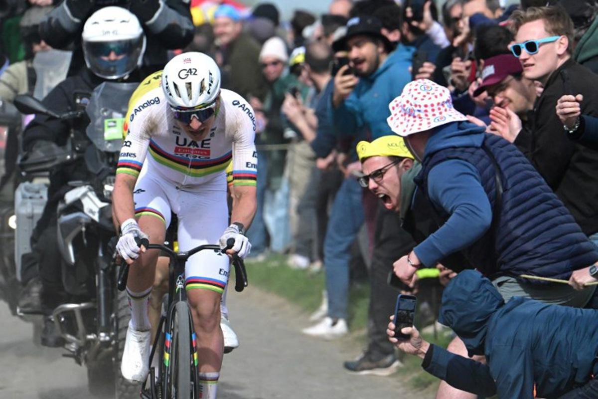 UAE Team Emirates XRG's Slovenian rider Tadej Pogacar cycles in a breakaway on a cobblestone sector during the 123rd edition of the Paris-Roubaix one-day classic cycling race, 258.3 km between Compiègne and Roubaix, northern France, on April 12, 2026. Bernard PAPON / POOL / AFP