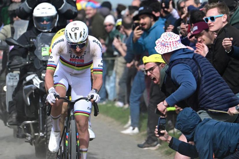 UAE Team Emirates XRG's Slovenian rider Tadej Pogacar cycles in a breakaway on a cobblestone sector during the 123rd edition of the Paris-Roubaix one-day classic cycling race, 258.3 km between Compiègne and Roubaix, northern France, on April 12, 2026. Bernard PAPON / POOL / AFP
