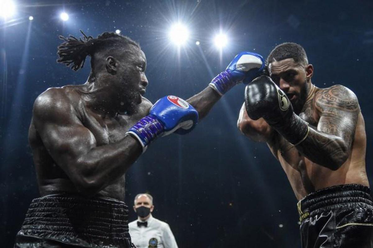 Belgium's Joel Tambwe Djeko (L) throws a jab at France's Tony Yoka during their EBU European Union heavyweight title boxing match at the H Arena in Nantes, western France, on March 5, 2021. JEAN-FRANCOIS MONIER / AFP
