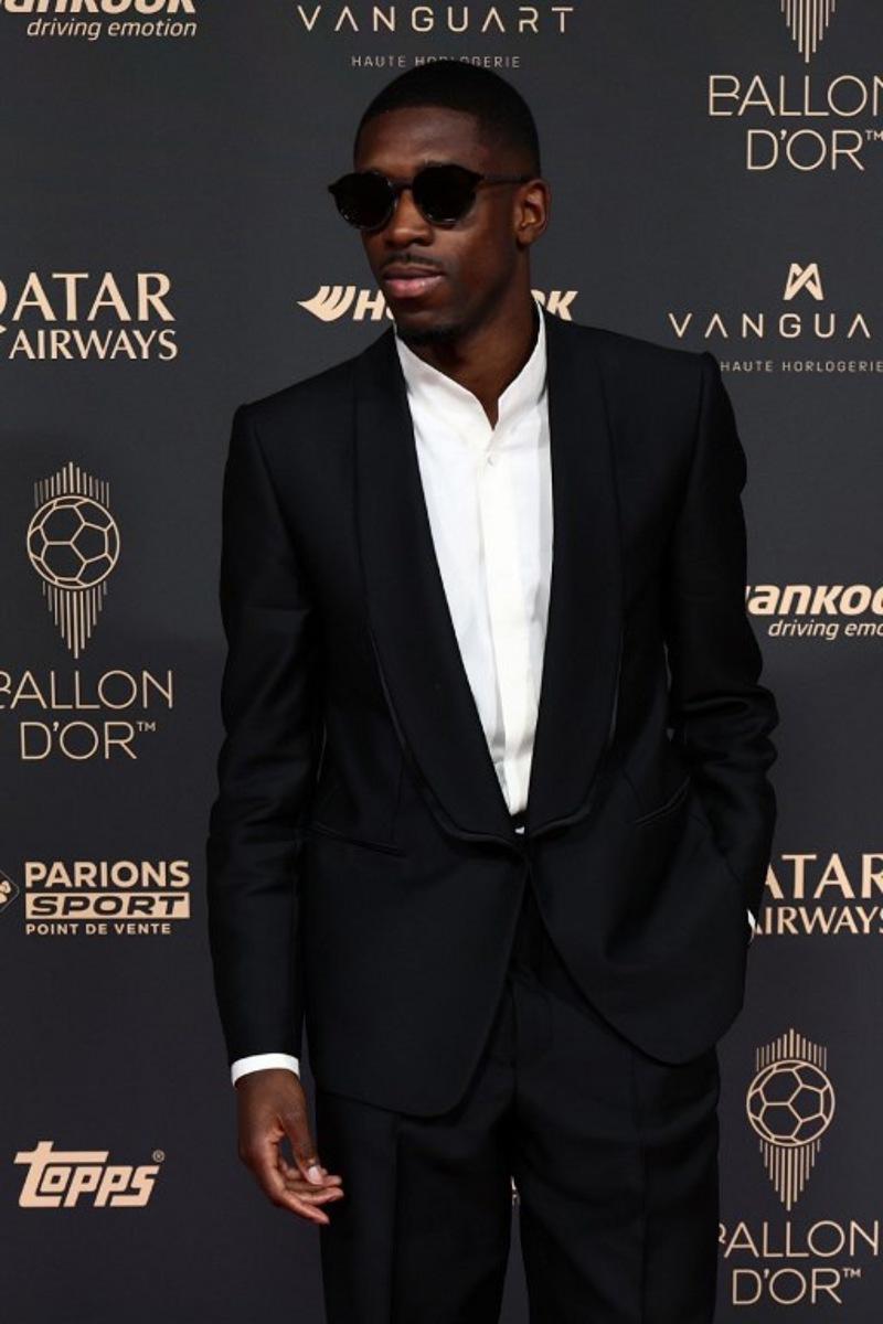 Paris Saint-Germain's French forward Ousmane Dembele poses upon arrival before the 2025 Ballon d'Or France Football award ceremony at the Theatre du Chatelet in Paris on September 22, 2025. FRANCK FIFE / AFP