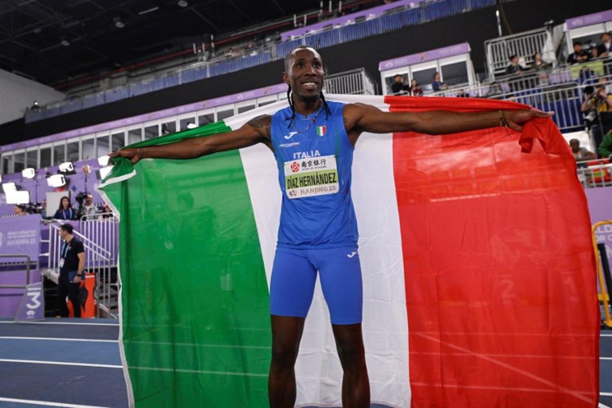 Italy's Andy Diaz Hernandez celebrates after winning the men's triple jump final during the Indoor World Athletics Championships in Nanjing, in eastern China's Jiangsu province, on March 21, 2025. WANG Zhao / AFP