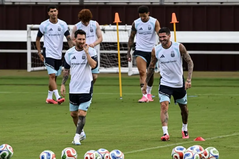 Argentina's players Lionel Messi (L) and Rodrigo De Paul (R) participate in a training session at Kyle Field in College Station, Texas, on June 5, 2026, the day before a friendly match against Honduras. Argentina will face Honduras in a friendly match on June 6, 2026. RONALDO SCHEMIDT / AFP